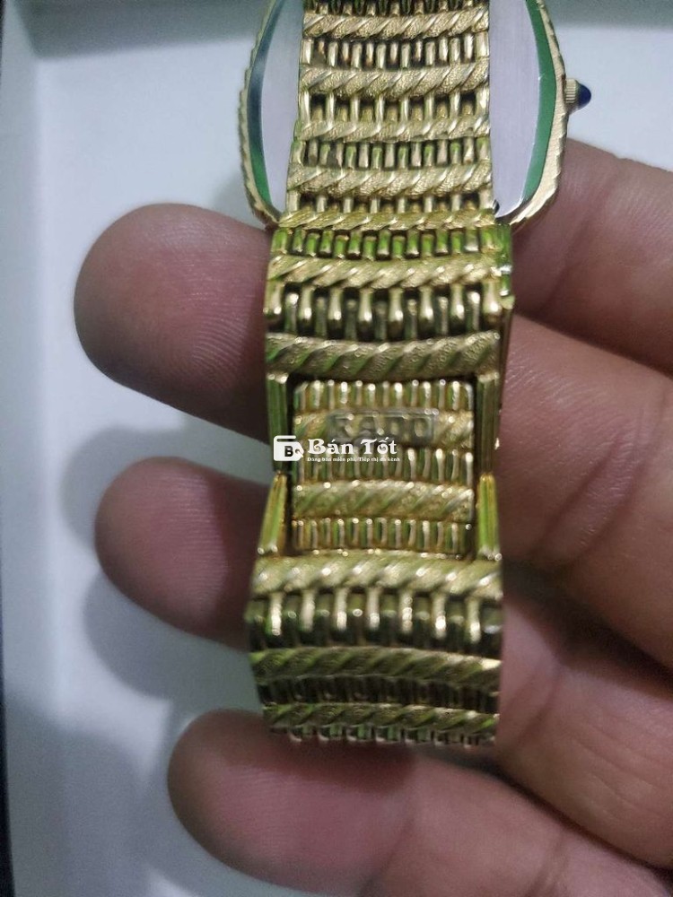 Rado pin thụy sỹ dây vàng.